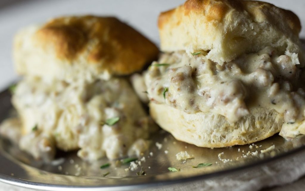 White gravy slathered between biscuits.