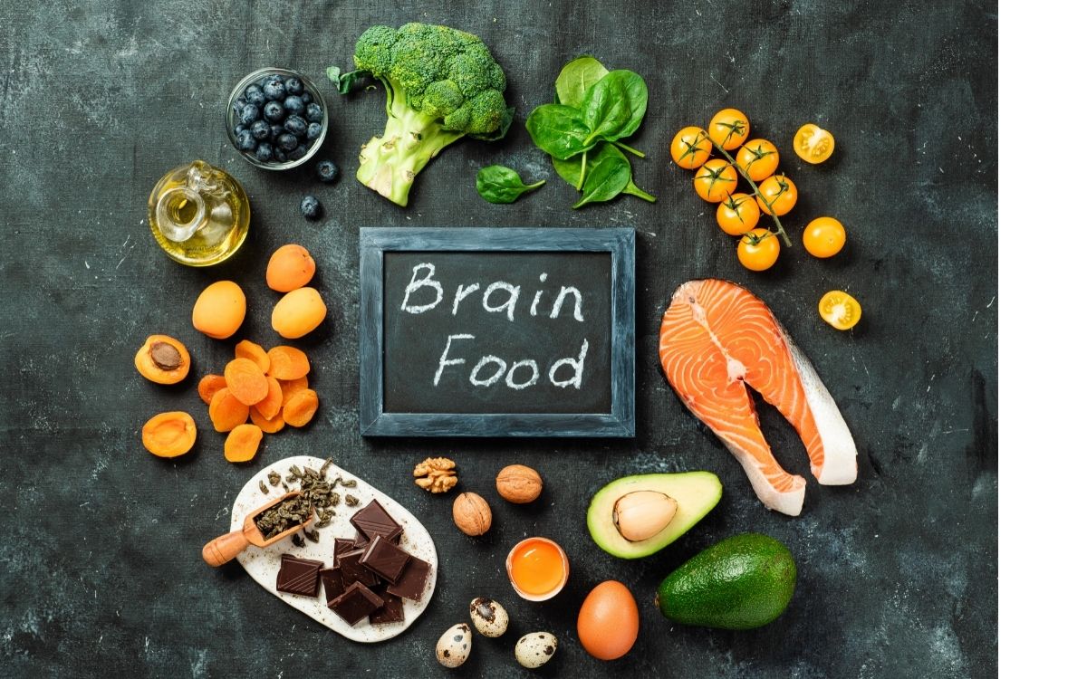 Multiple foods said to help your brain sits in assortment around a sign that says brain food.