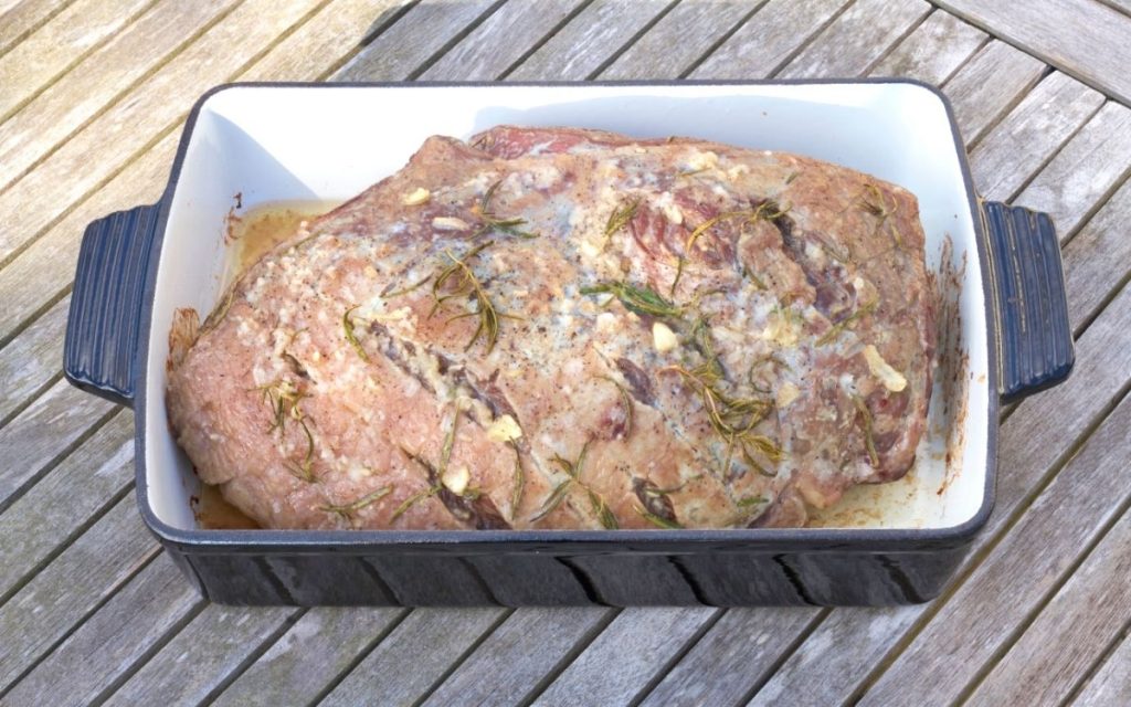 Freshly cooked rump roast in a pan ready to be served.