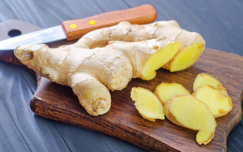 ginger root sliced on cutting board
